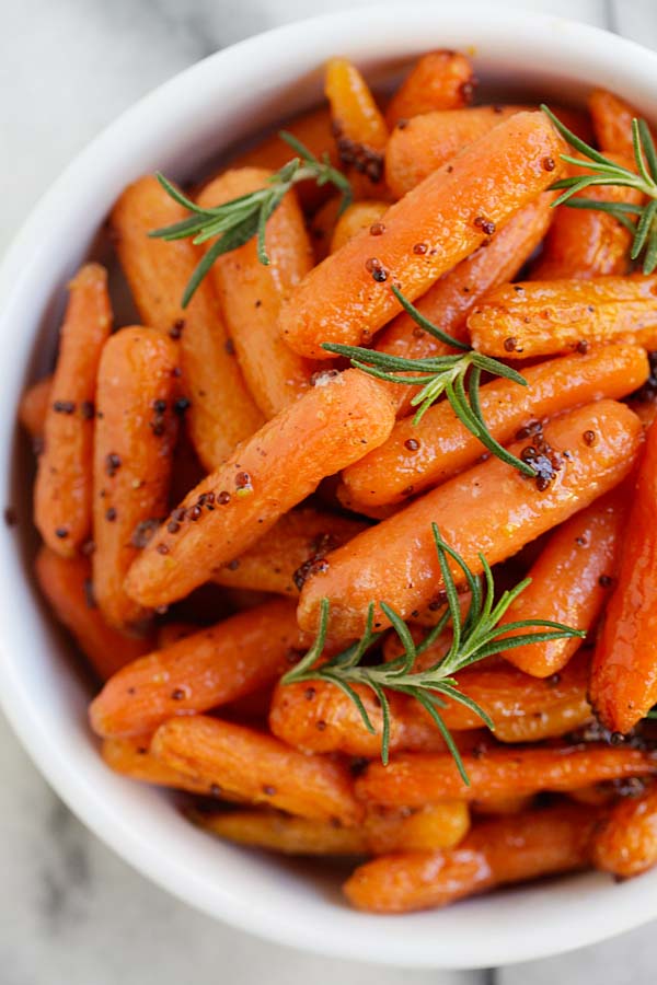 Healthy homemade roasted carrots recipe with maple syrup and dijon mustard, ready to serve.