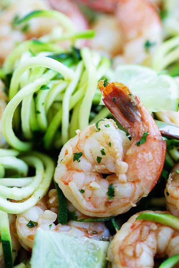 Closed up healthy zoodle salad with shrimps sauteed in brown butter, cilantro and lime juice.