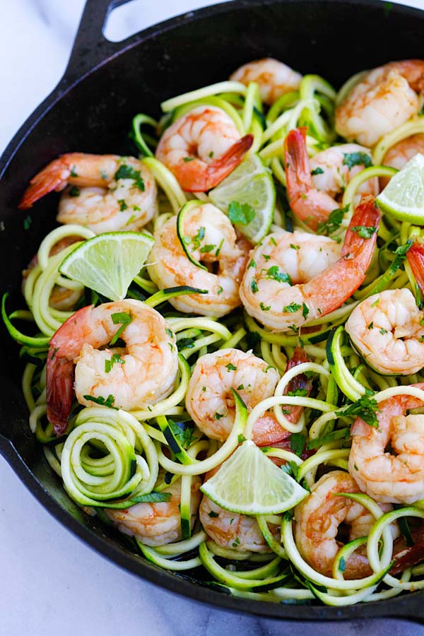 Easy and healthy homemade sauteed brown butter cilantro lime shrimp with grated zucchini salad.