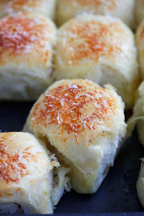 Easy homemade soft cheesy Parker House Rolls bread.