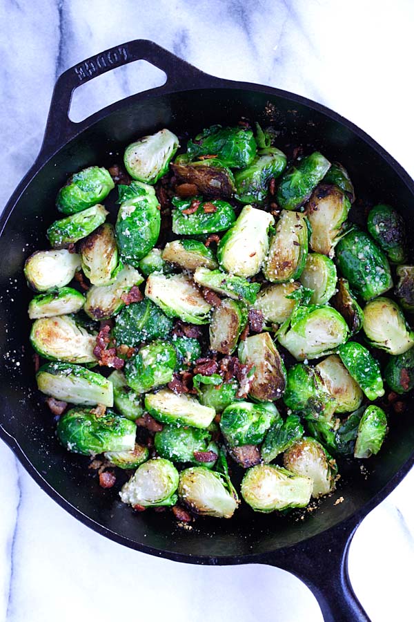 top down view of easy skillet roasted Brussels sprouts with garlic, Parmesan cheese and bacon, ready to serve.