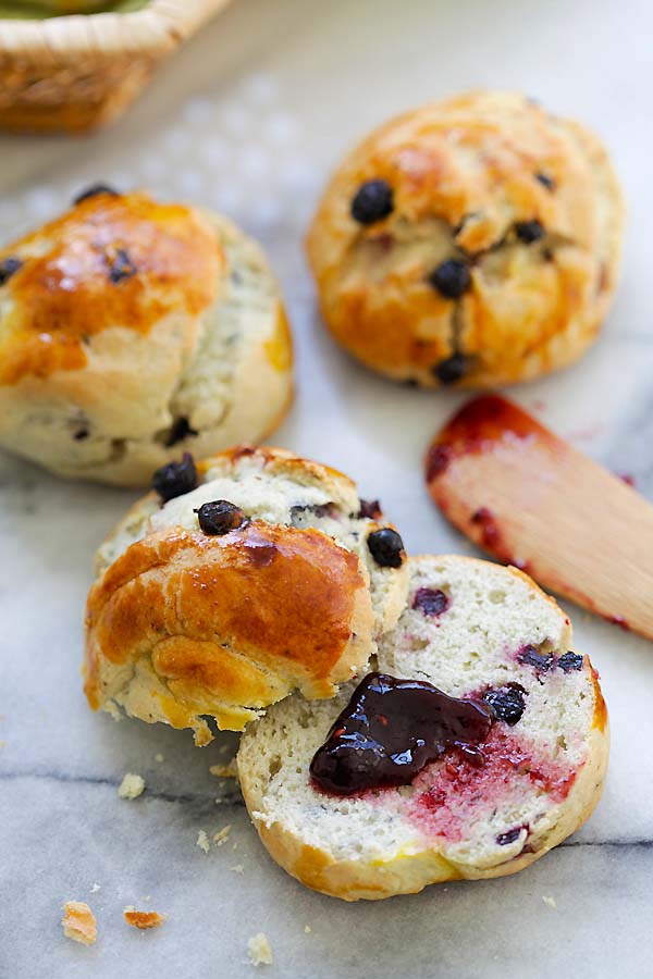 Healthy homemade scones loaded with fresh blueberries with berries jam.