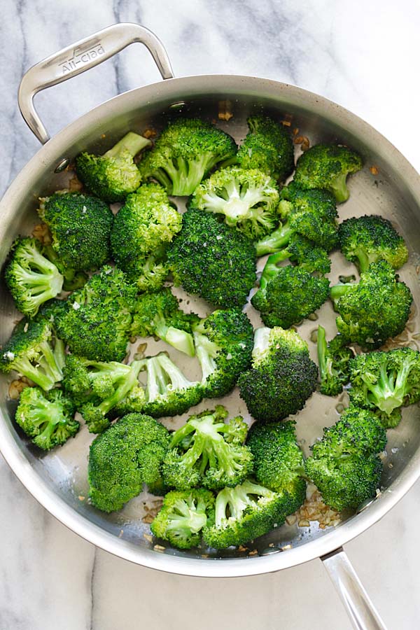 Easy and quick homemade brown butter garlic honey toasted broccoli florets in a skillet.