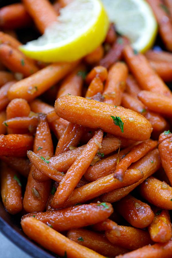 Easy delicious roasted baby carrots in brown sugar sauce.