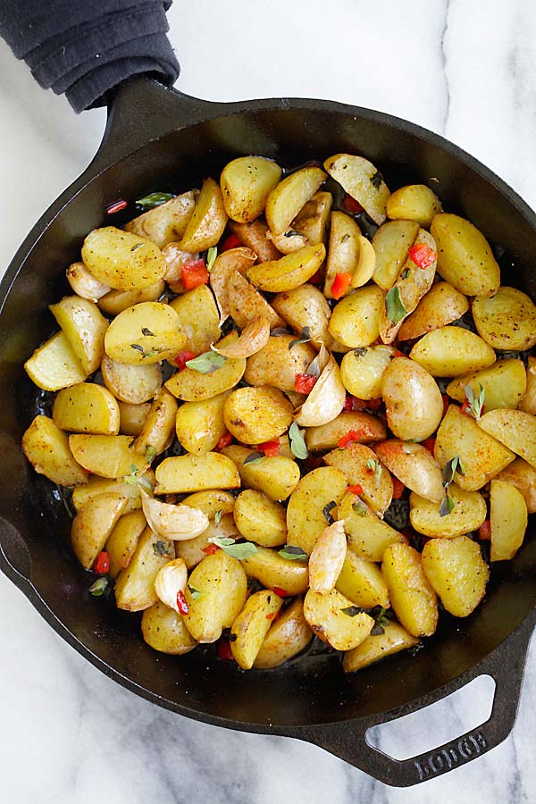 Easy and delicious Greek style roasted potatoes in a skillet.