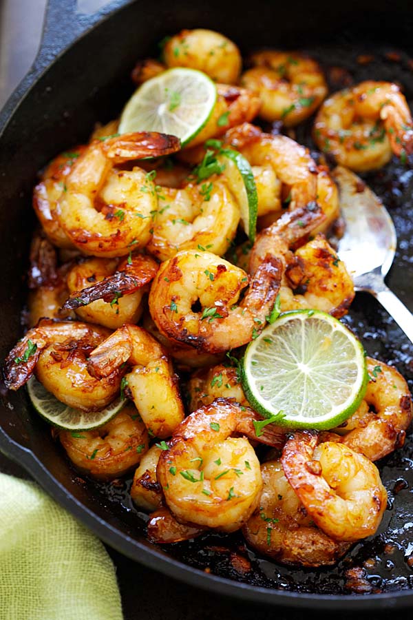 Easy and quick sauteed sticky skillet shrimp with fresh lime in a skillet.
