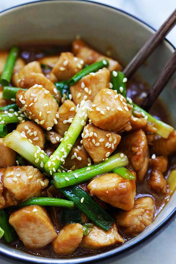 Stir-fry Asian chicken with scallions and brown sauce Mongolian style.