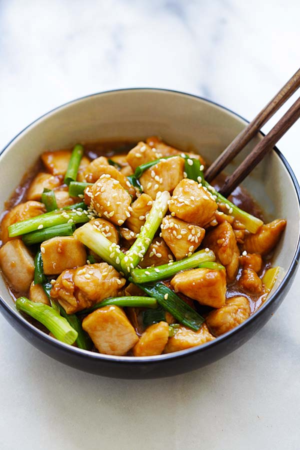 Easy and quick Mongolian chicken stir fry in brown sauce served in a bowl.
