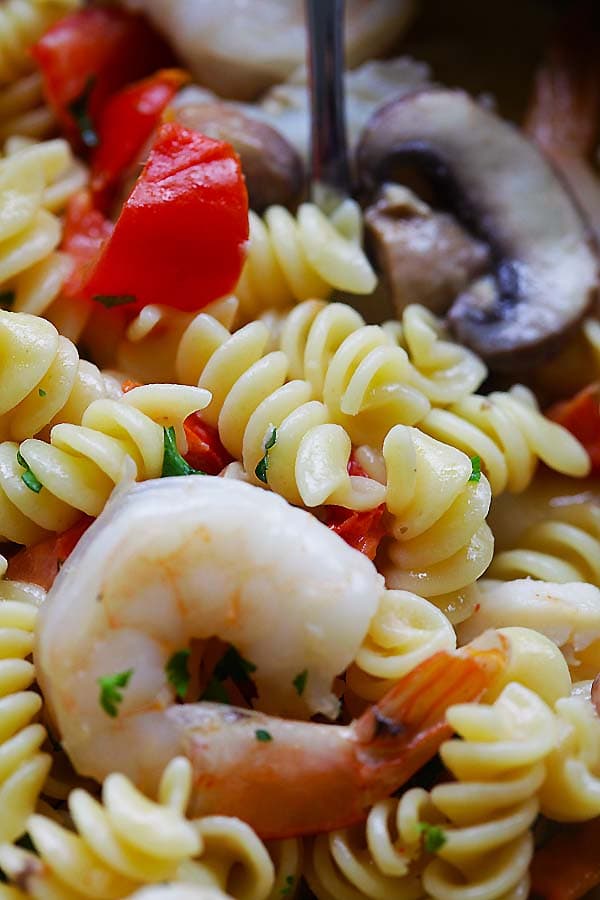 Close up of easy homemade scallop and shrimp pasta in a pot, ready to serve.