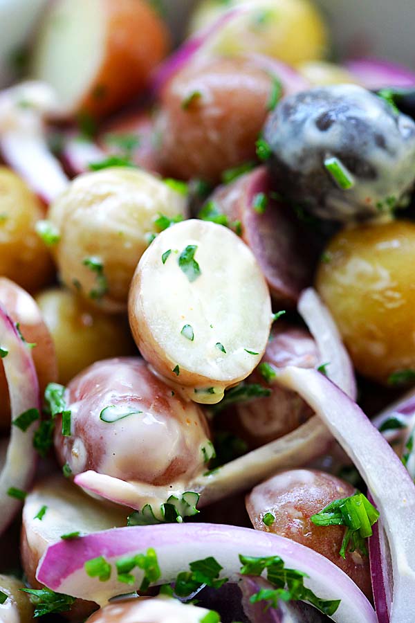 Close up delicious homemade potato salad with tiny and colorful peewee baby potatoes, ready to serve.