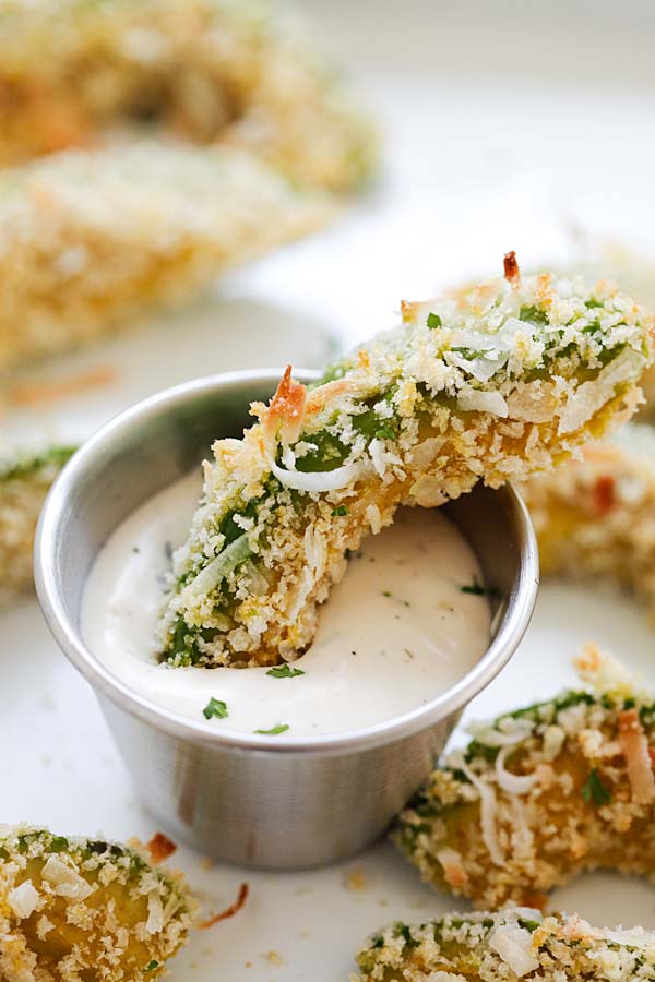 Crispy curry flavored avocado wedges dipped into ranch dipping sauce.