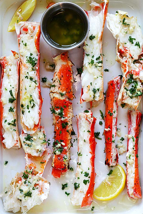 Crab legs recipe with King crab legs and butter in oven.