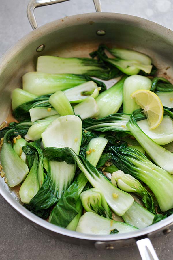 Easy sauteed bok choy with soy and ginger in a skillet.