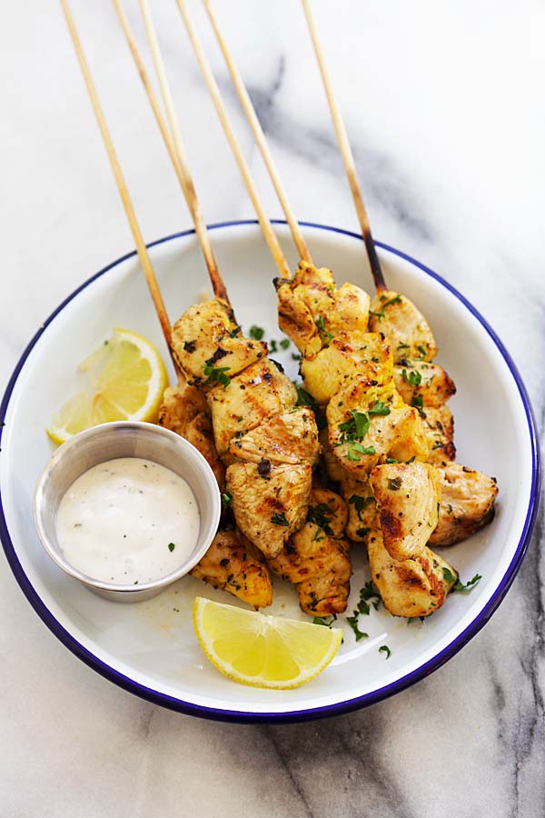 Delicious and easy grilled Mediterranean Greek chicken souvlaki recipe made with garlic, yogurt, lemon and olive oil.
