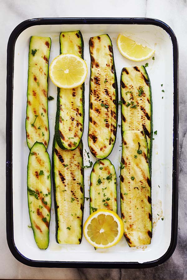 Grilled zucchini with lemon butter and herb.