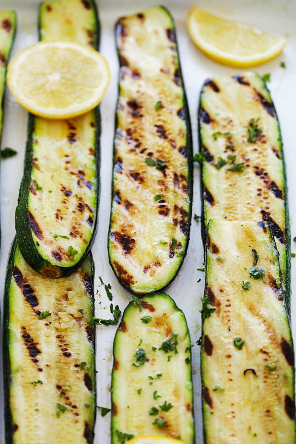 A slice of grilled zucchini with char marks.