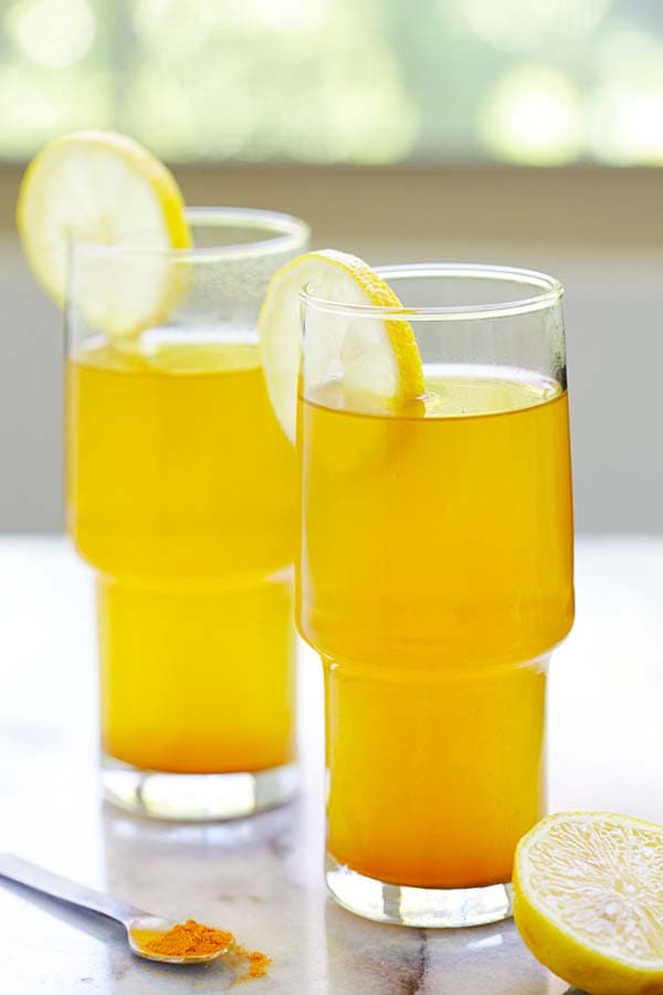 Healthy homemade yellow detox tea made with turmeric, apple cider vinegar and honey.