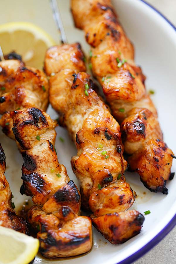 Easy homemade orange glaze Filipino chicken skewers close up.