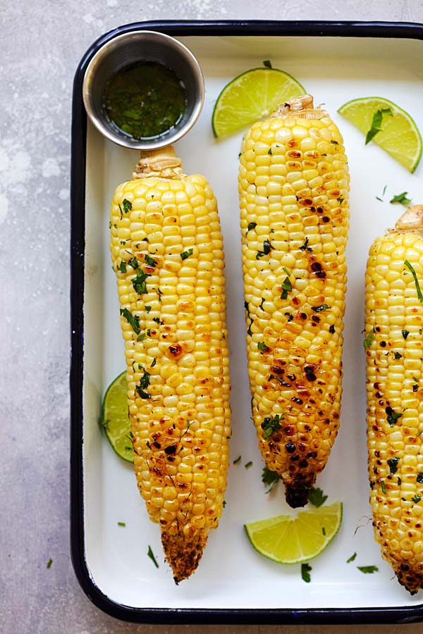 Easy delicious honey butter grilled corn, in a baking tray.