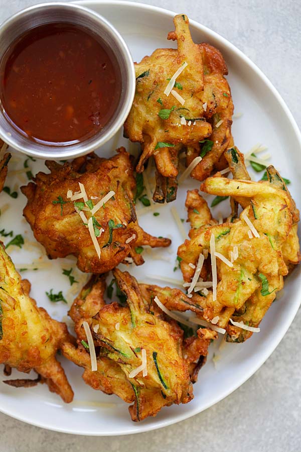 Crispy and easy Zucchini Fritters, served in a plate.