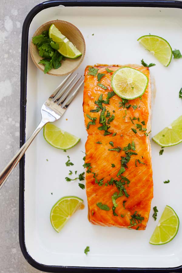 Easiest and best oven-baked cilantro lime salmon with a fork.