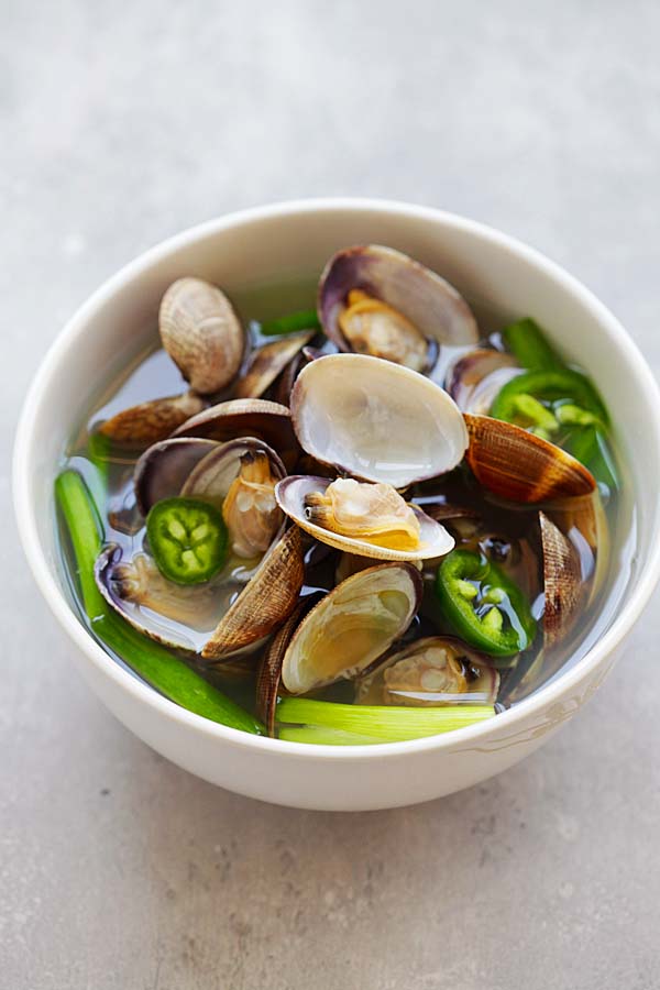 Easy and quick Korean clam clear soup, served in a bowl.