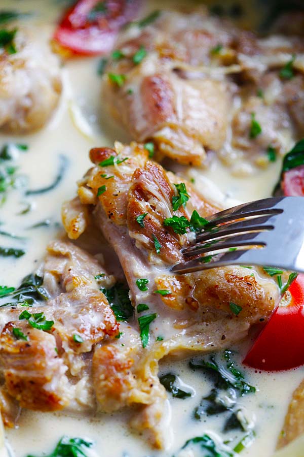 Close up of lemon butter chicken poked with a fork.