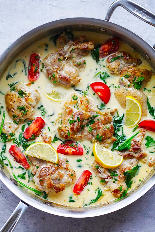 Easy one-pot lemon butter chicken with spinach and tomatoes in creamy white sauce.