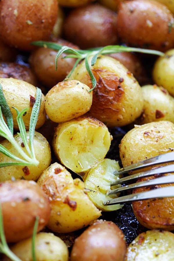 Rosemary roasted potatoes cut in half and poked with a fork.