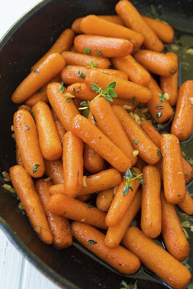Healthy and easy maple roasted carrots in a skillet.