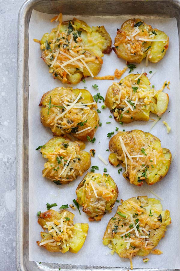 Easy and delicious potatoes recipe with smashed potatoes loaded with butter, garlic and Parmesan cheese.