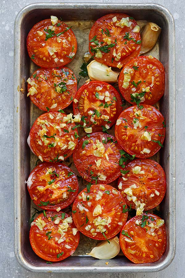 Healthy, easy and quick Garlic Roasted Tomatoes in a baking tray.