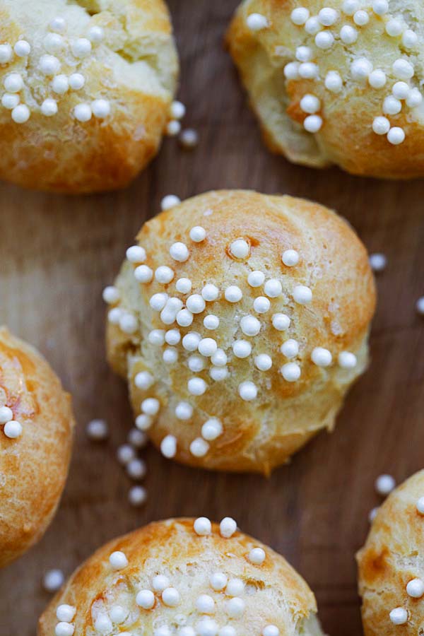 Healthy homemade French cream puffs garnished with sugar.