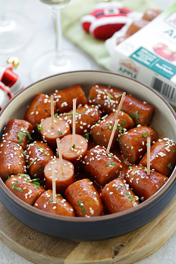 Honey Sriracha Sausage Bites in pieces, served in a serving dish.