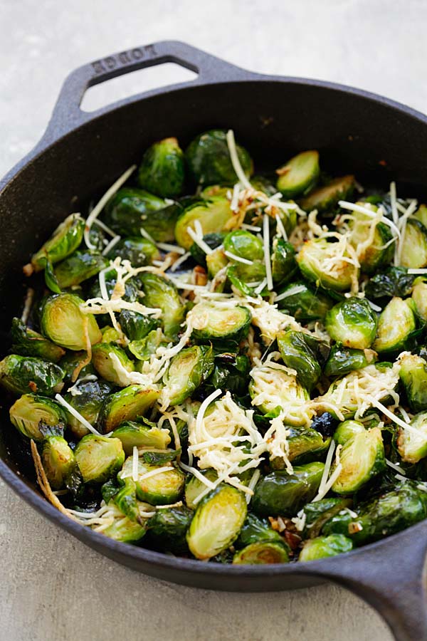 Easy oven-roasted brussels sprouts served in cast iron skillet.