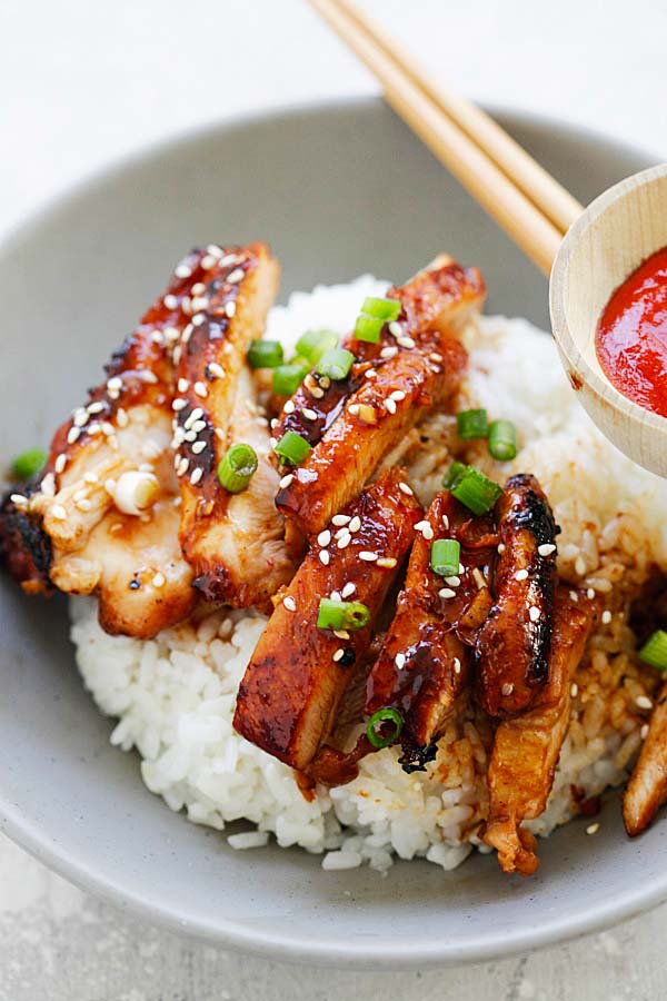 Garlicky, spicy, sweet and savory Garlic Sriracha Chicken on a bowl of jasmine rice.