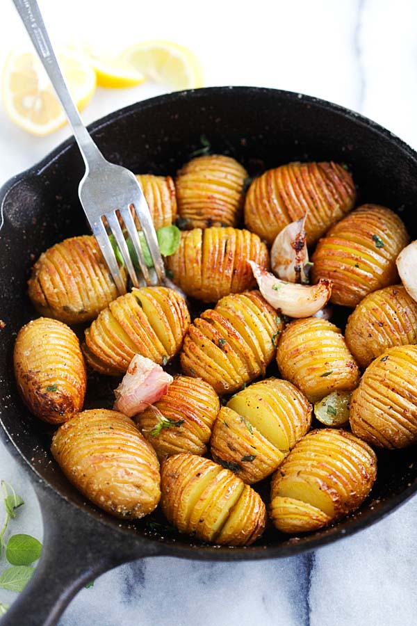 Hasselback potatoes in a cast-iron skillet