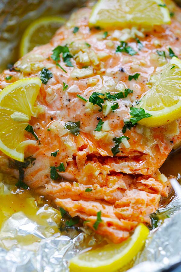Juicy and delicious oven-baked Salmon fillet with Honey Garlic Butter sauce on a foil wrap.