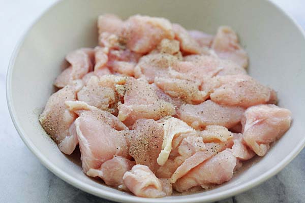 Chopped and seasoned chicken breasts from Blue Apron in a bowl.