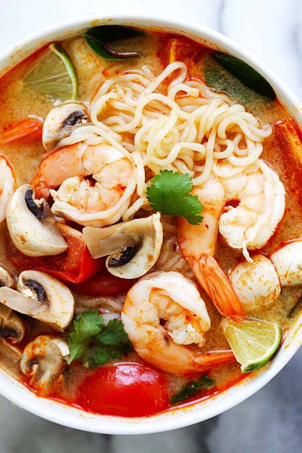 Instant and easy Thai Shrimp Noodle Soup with shrimp, mushrooms, herbs and tomatoes ready to serve.