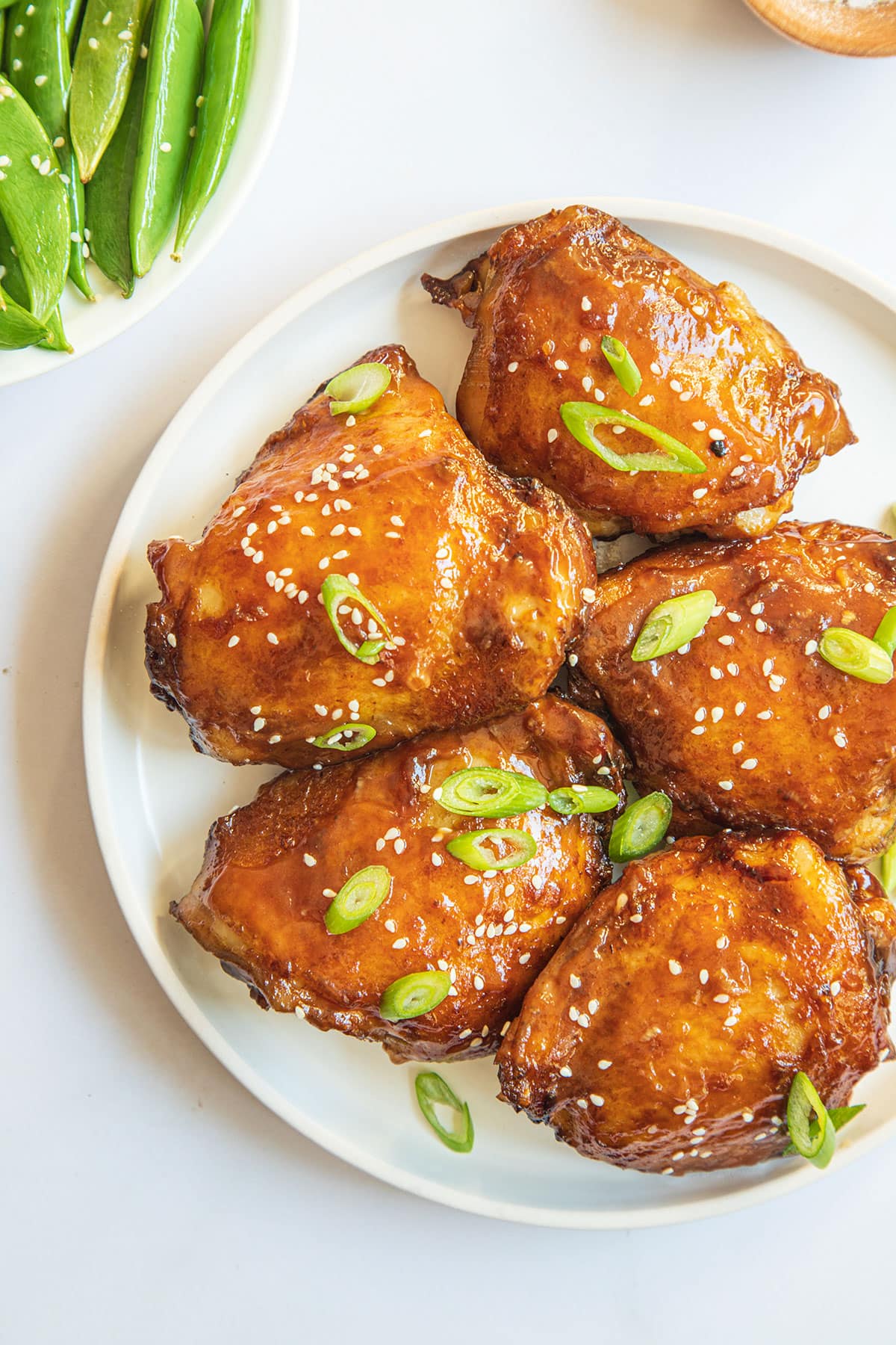 Easy and quick oven baked honey soy chicken in a white serving dish.
