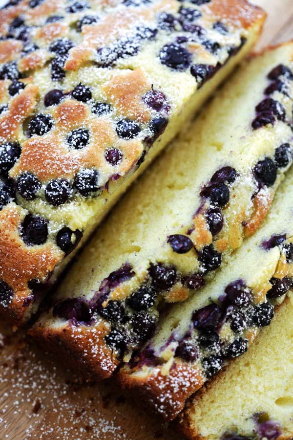 Freshly baked blueberry butter cake topped with fresh blueberries.
