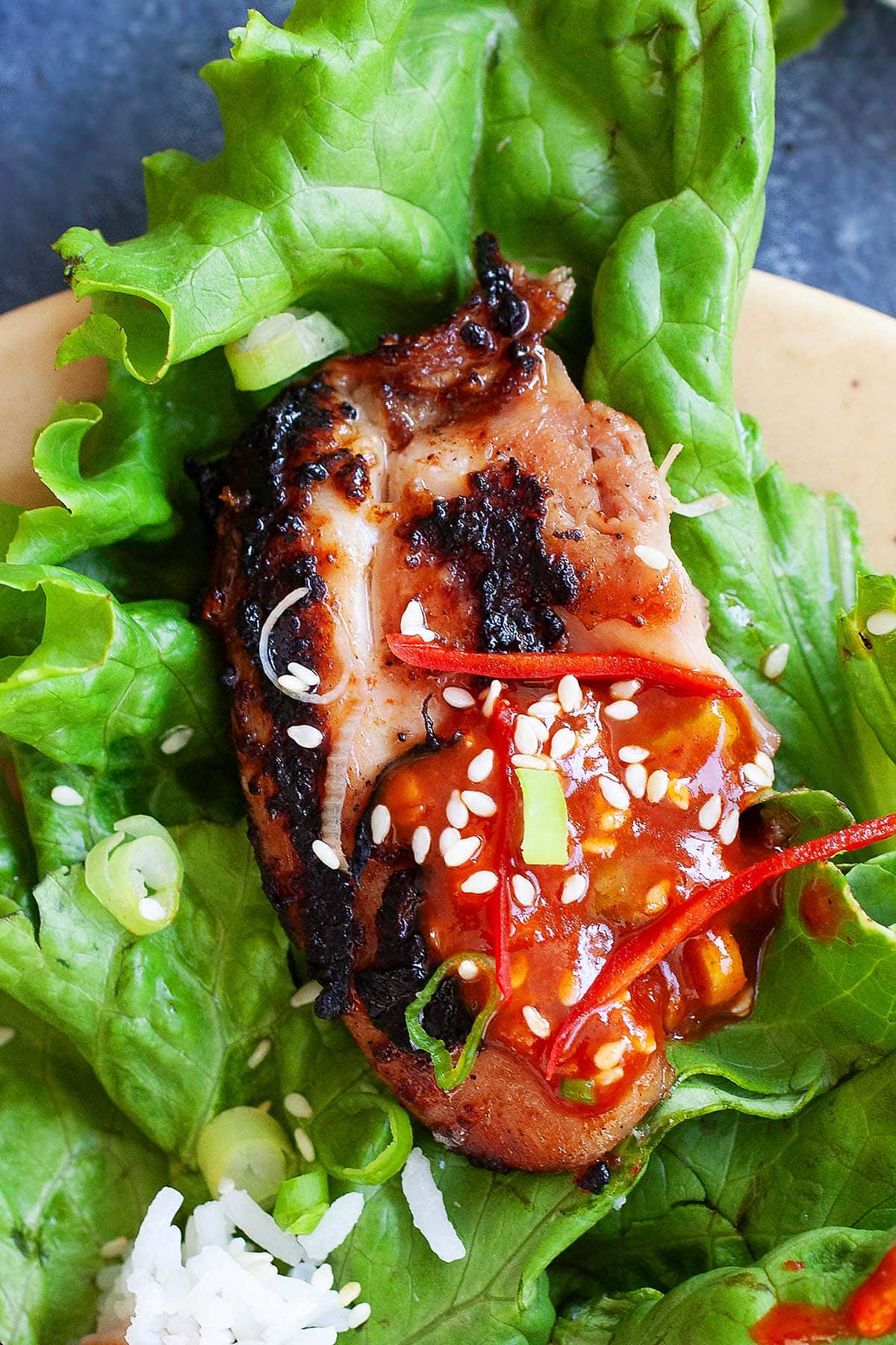 Korean BBQ Chicken  served with lettuce and rice. 