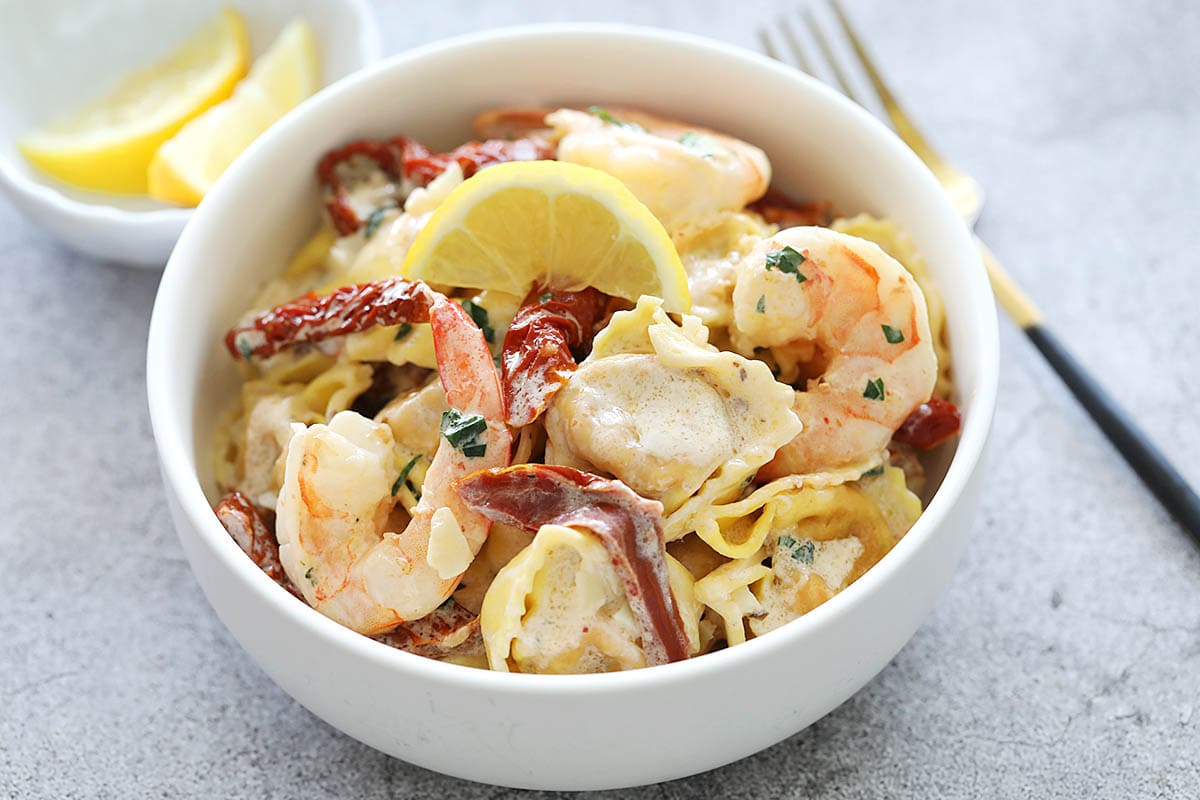 Tortellini recipe with sun dried tomatoes, garlic, and shrimp in creamy garlic sauce. 