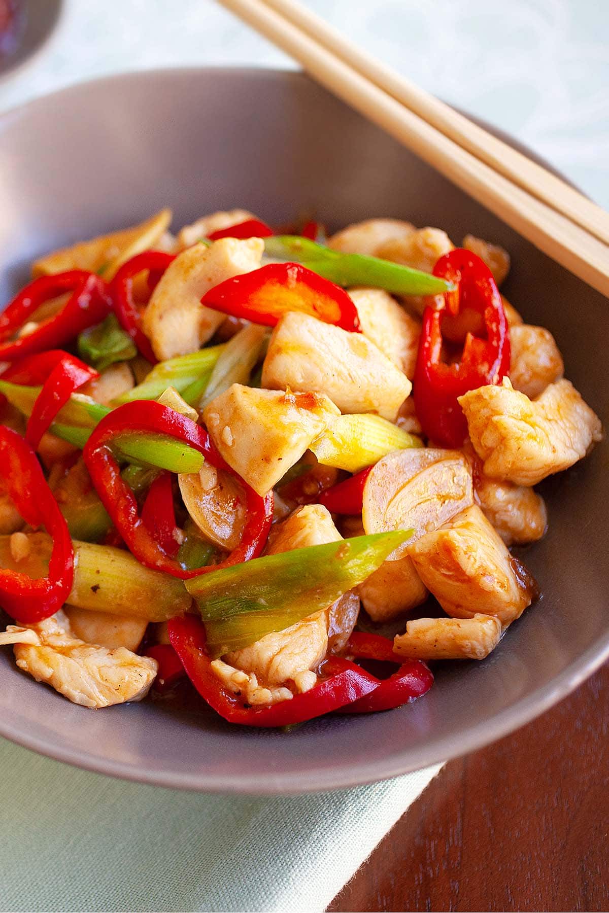 Easy spicy chicken stir fry recipe with diced chicken breasts, red chilies, scallions in a spicy douban bean sauce.