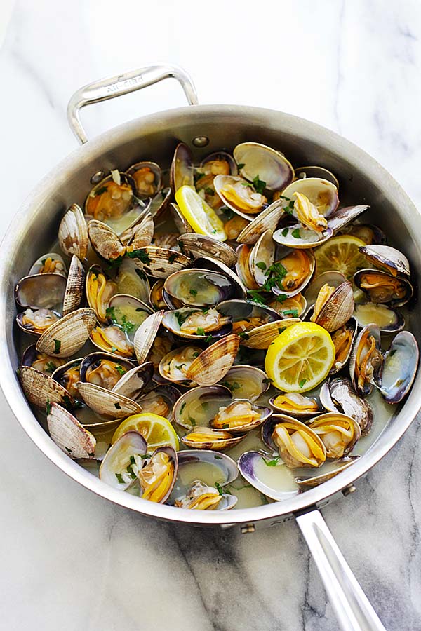 Beer steamed clams in a skillet ready to serve.