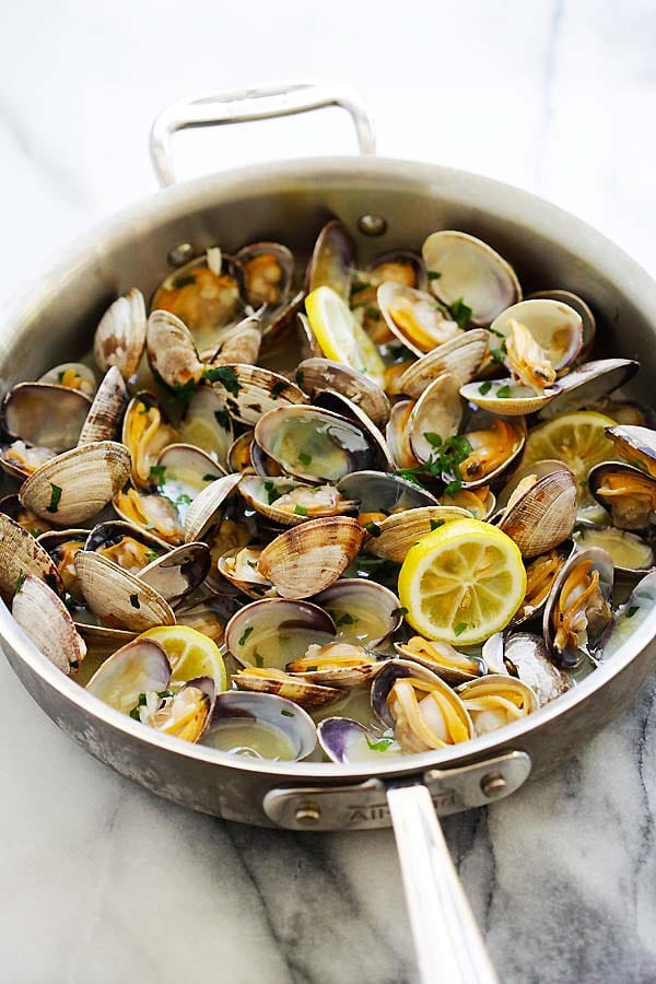 Skillet of clams steamed with beer, butter and lemon sauce.