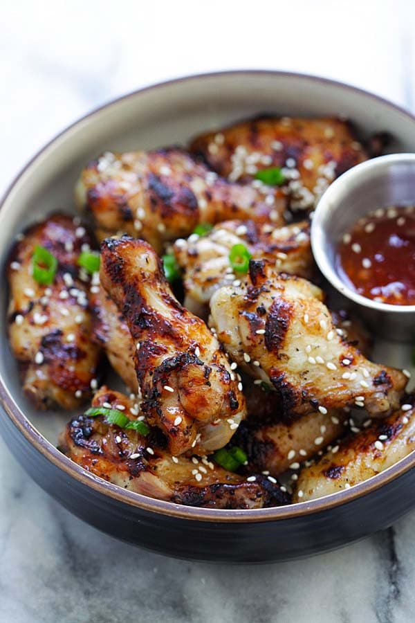Easy grilled chicken wings recipe with five spice powder rub on a plate.