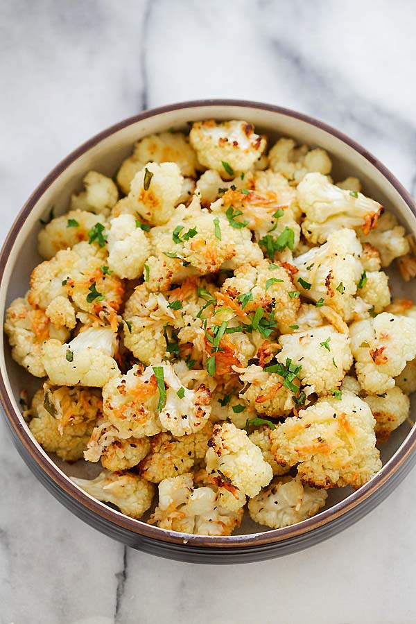 Quick and easy cauliflower florets roasted in the oven with garlic and Parmesan cheese.