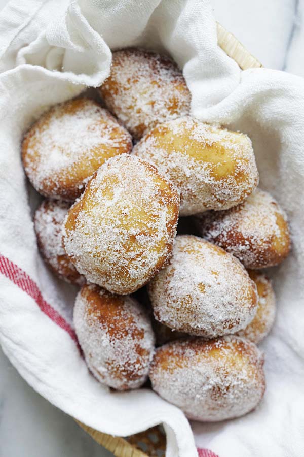 Easy and quick malasadas Portuguese donuts coated with granulated sugar.